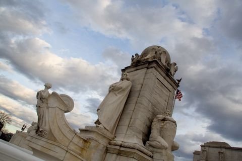 The Columbus fountain statues at Union Station under a dramatic sky